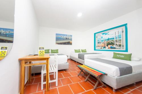 Postel nebo postele na pokoji v ubytování Hotel Ayenda Cartagena Blue 1804