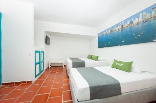 Postel nebo postele na pokoji v ubytování Hotel Ayenda Cartagena Blue 1804