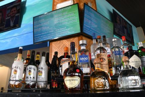 a bunch of bottles of alcohol sitting on a bar at Wyndham Lake Buena Vista – Disney Springs® Area in Orlando
