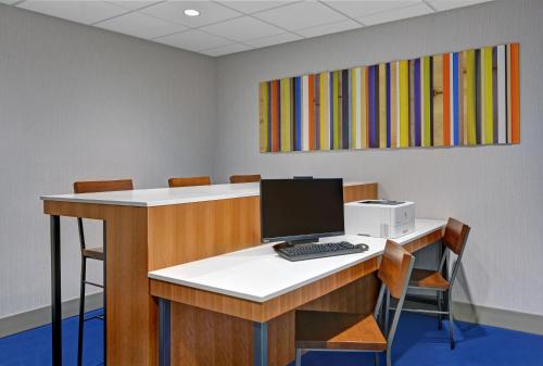 an office with a desk with a computer on it at Holiday Inn Express Atmore by IHG in Atmore