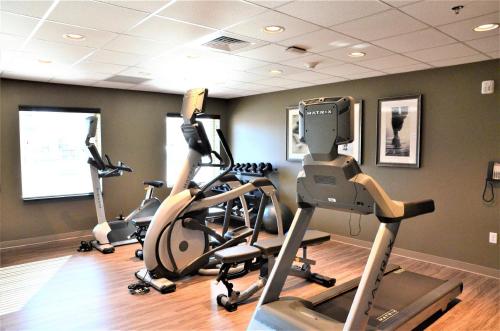 a gym with three exercise bikes in a room at Staybridge Suites - Orenco Station by IHG in Hillsboro