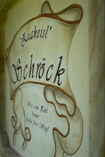 a cake with a drawing of a hat on top at Chalet Schröckgut in Bad Hofgastein