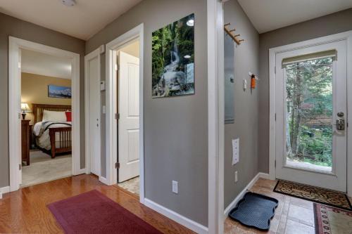 a hallway of a home with a door leading to a bedroom at Hanging Glacier Chalet in Girdwood