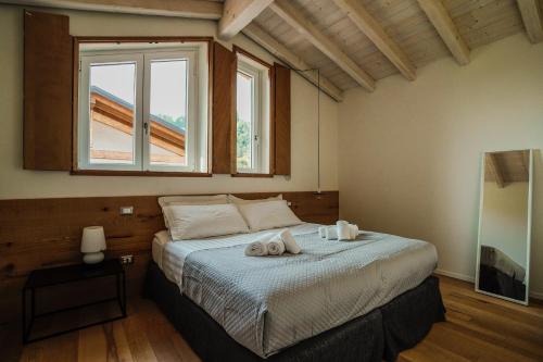 Giường trong phòng chung tại Casa Olivi Apartments