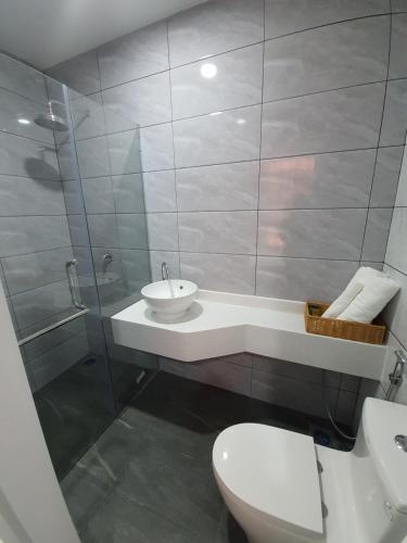 a bathroom with a sink and a toilet and a shower at PARADIAN HOTEL in Seremban