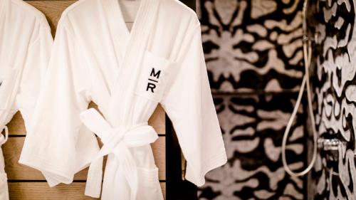 a white robe with the word myryan on it at YOHO Hollywood Roosevelt Hotel in Macau