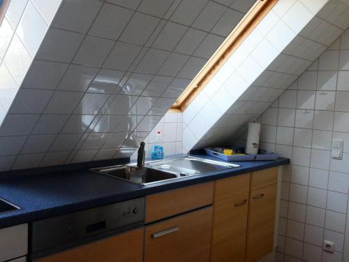 a kitchen with a sink and a counter top at Ostsee-Ferienoase-2-Raum-App-Typ-3 in Klütz