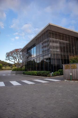 a large office building with a lot of windows at Royal St. Andrews Hotel, Spa and Conference Centre in Port Alfred