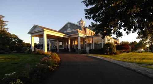 a large white house with a driveway at Black Point Inn in Scarborough
