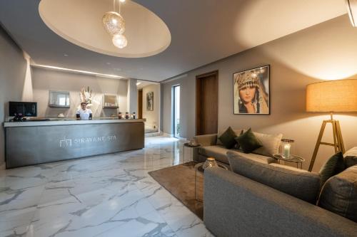 a living room with a couch and a lobby at Sirayane Boutique Hotel & Spa Marrakech in Marrakesh
