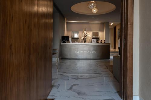 a lobby with a marble floor and a counter at Sirayane Boutique Hotel & Spa Marrakech in Marrakesh