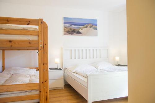 Voodi või voodid majutusasutuse Schoene-Aussichten-Strandnah-gelegen toas