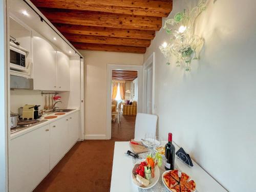 a kitchen with a table with a bowl of food on it at Ai Savi di Venezia in Venice