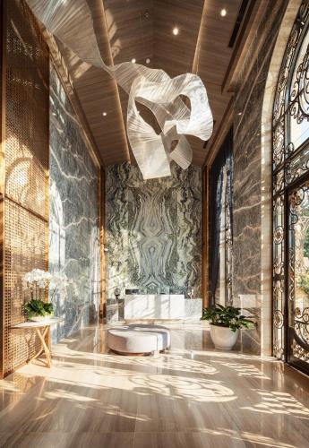 a bathroom with a ceiling fan and a toilet at D'Lecia Ha Long Hotel in Ha Long