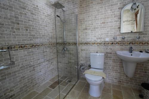 a bathroom with a toilet and a sink at Villa Amare in Kalkan