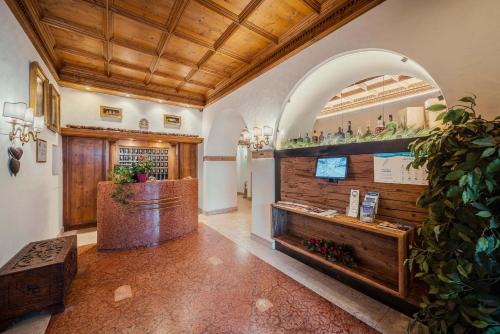 a tasting room with a bar in a building at Royal Hotel Cortina in Cortina dʼAmpezzo