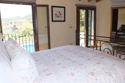 Postel nebo postele na pokoji v ubytování Villa Maria, bonita casa con jardín y piscina privada en Andratx