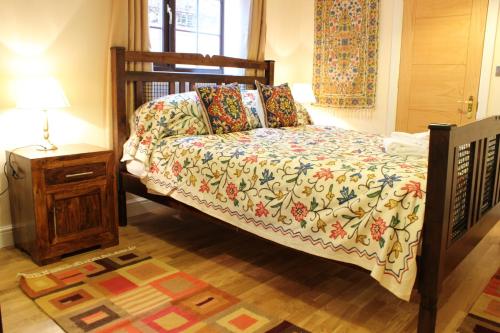 Кровать или кровати в номере Church Farm Barns