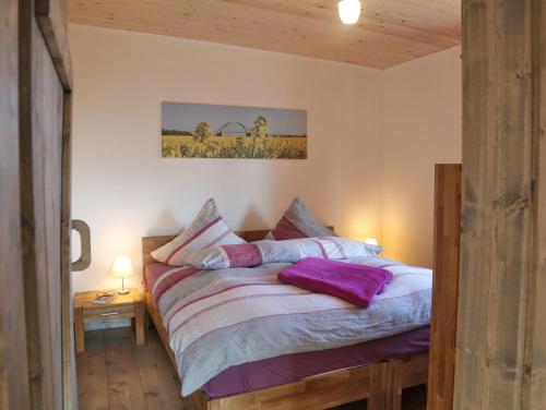 מיטה או מיטות בחדר ב-Ferienhaus-Rotdorn-Haus-Sued