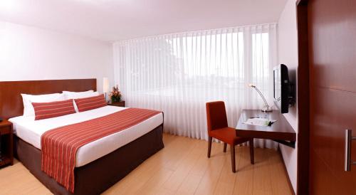 Hotel Estelar El Cable tesisinde bir odada yatak veya yataklar