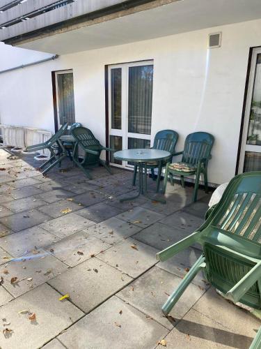 a patio with chairs and a table and chairs at Hotel Seehaus in Horn-Bad Meinberg