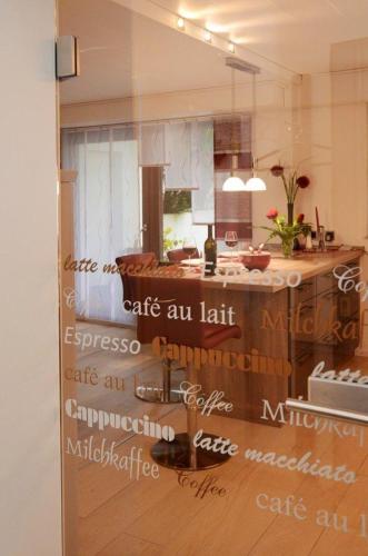 a kitchen with a window with words on it at Ferienwohnung-Marion in Ennepetal
