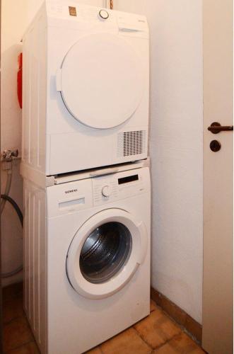 a washer and dryer in a small room at Ferienwohnung-Marion in Ennepetal
