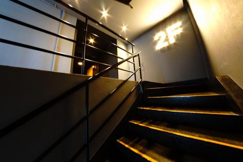 a set of stairs in a building with the number twenty five at Swiss Inn in Sapporo