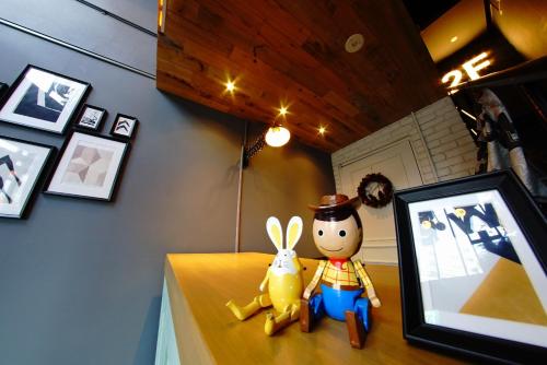 a stuffed animal and a stuffed rabbit sitting on a table at Swiss Inn in Sapporo