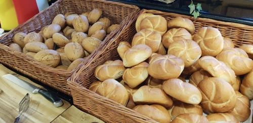 two baskets filled with bread on a table at All Inclusive Hotel Bachmayerhof in Uderns