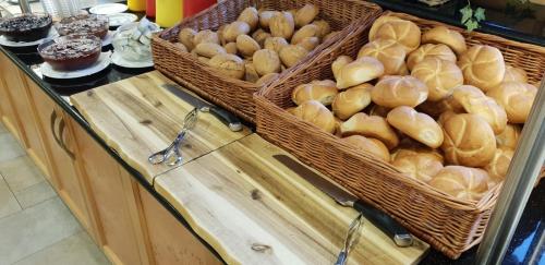 two baskets of bread on a counter in a bakery at All Inclusive Hotel Bachmayerhof in Uderns