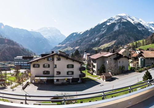 a small town with mountains in the background at Appartementhaus Quadern (A302) in Valens