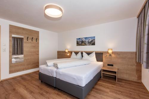 מיטה או מיטות בחדר ב-Apart Alpenjuwel Sölden