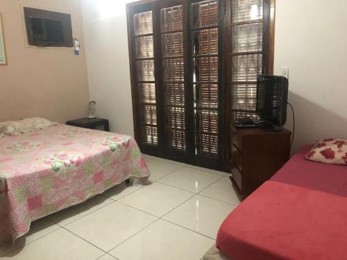 En eller flere senge i et værelse på Hostel Icaraí Inn