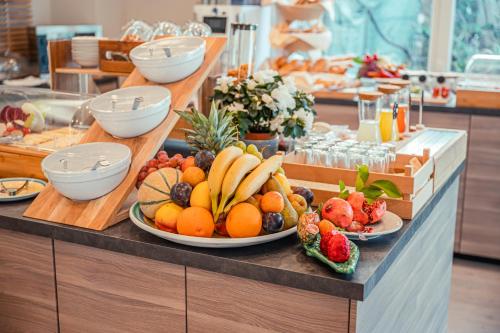 a buffet with fruits and vegetables on a table at Hotel Rivage Taormina in Taormina