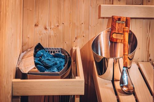 a wooden box with a kitchen utensil and a knife at Apartmány Jedovnice in Jedovnice