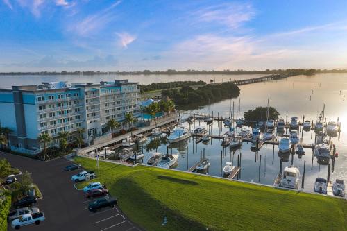 an aerial view of a marina with boats in the water at Compass Hotel by Margaritaville Anna Maria Sound in Bradenton