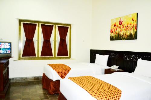 Krevet ili kreveti u jedinici u okviru objekta The Kresna Hotel