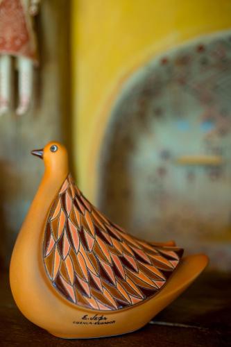 a plastic bird toy sitting on a table at Akawanka Lodge in San Agustín