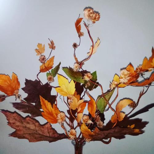 a vase with a bunch of autumn leaves at Sowinka in Lutowiska