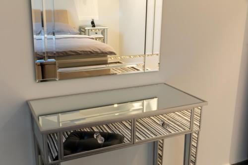 Una cama o camas en una habitación de Lexor
