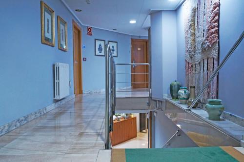 a staircase in a room with blue walls at Cesaraugusta in Zaragoza