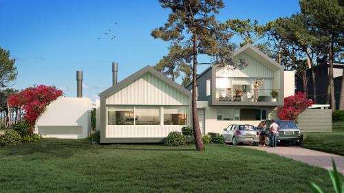 two people standing in front of a house at Best Vila in José Ignacio - Pinar del Faro with maid! in José Ignacio
