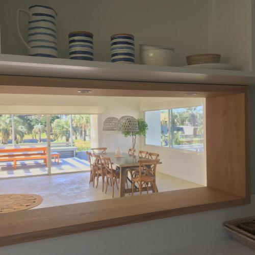 a dining room with a table and chairs at Best Vila in José Ignacio - Pinar del Faro with maid! in José Ignacio