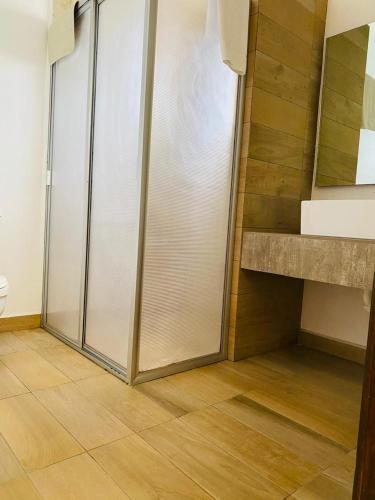 a walk in closet with a sliding glass door at Hotel La Mansión in San José Iturbide