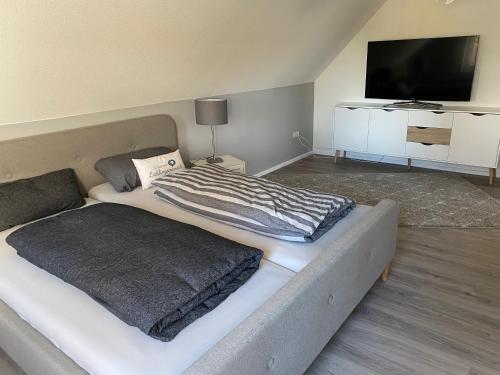 Postel nebo postele na pokoji v ubytování Ferien-am-Uhlenmeer Keine-Monteure