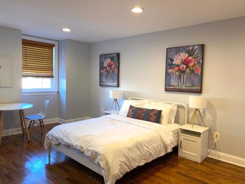 a bedroom with a bed with two pictures on the wall at Alina & Fanny - Philadelphia 1210 Mt Vernon St in Philadelphia