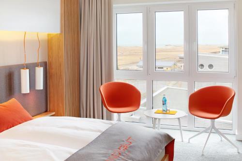 Postel nebo postele na pokoji v ubytování Strandgut Resort