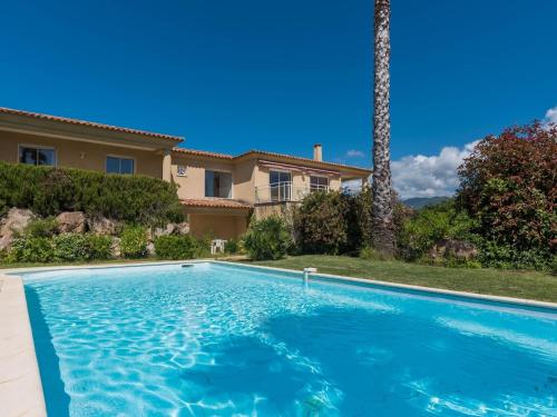 a swimming pool in front of a house at Modern villa with private pool in Santʼ Andrea-dʼOrcino