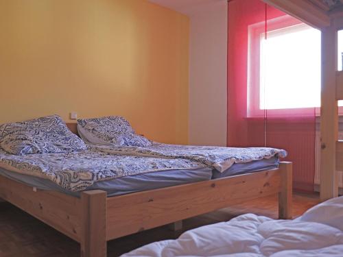 a bedroom with a bed and a window at Wohnung in Huddingen mit Terrasse in Bad Wildungen